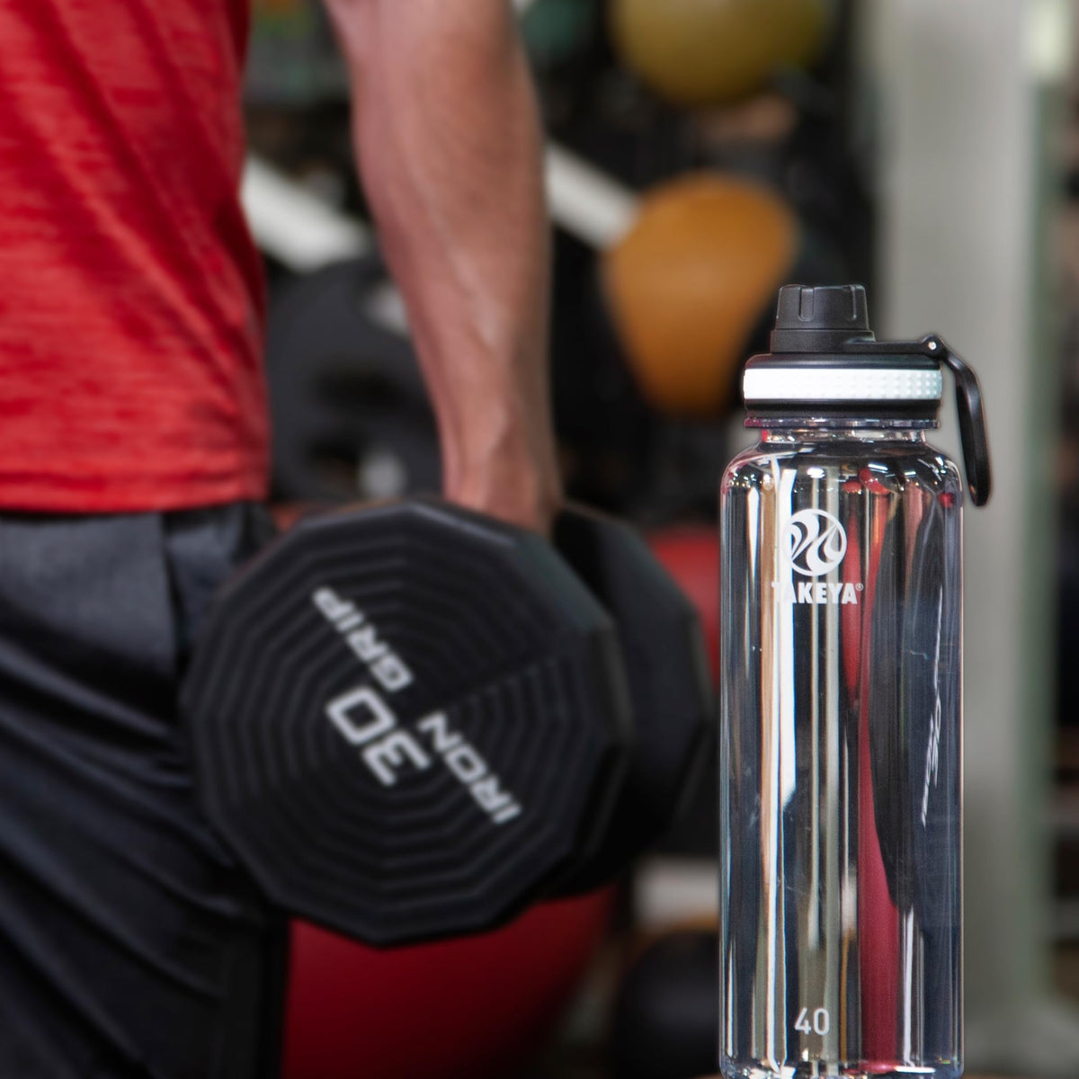 Takeya Tritan Water Bottle with Spout Lid - Durable Dishwasher-Safe Water Bottle - Simple, Modern Bottle - Reusable Water Bottle with Leak-Proof Lid - 40 oz, Clear