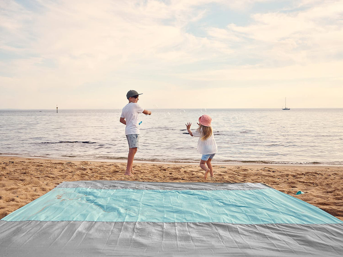 WEKAPO Beach Blanket - Sandproof Waterproof Extra Large Beach Mat | Oversized Sand-Free Lightweight Quick-Drying | Beach Vacation Essentials with Stakes & Corner Pockets (Grey, 9x7 FT)