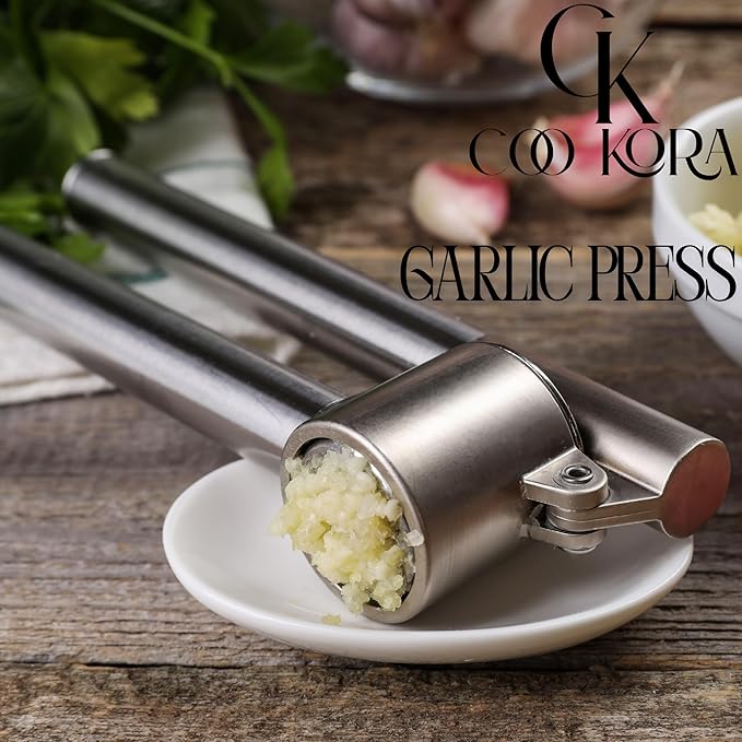 COO KORA Heavy Duty Garlic Press, Handheld Garlic Mincer, 304 Stainless Steel Garlic Press, Ergonomic, Durable, No Hand Odor, Just Put It in the Bowl, Dishwasher Safe